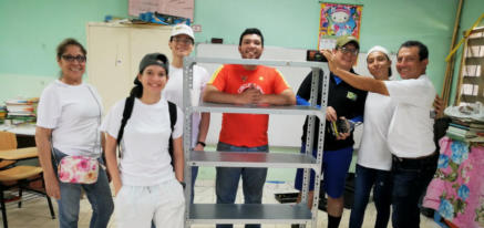 Volunteers with the completed shelf